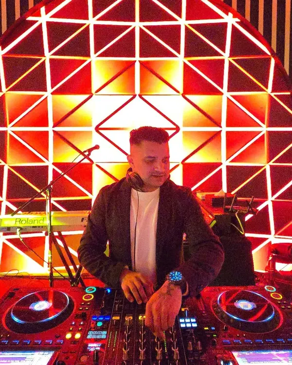 At the console for a sensational 60th birthday party in Dubai. The red geometric backdrop created a vibrant and modern look for the event.