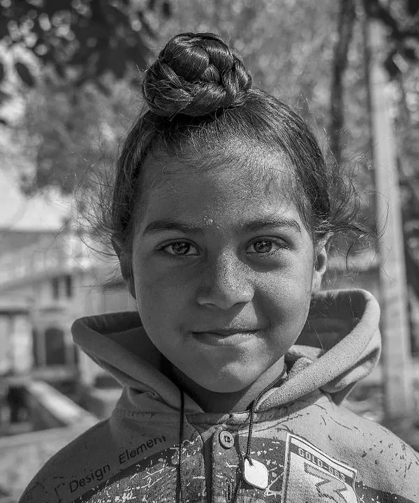 A black and white portrait of a young Sikh girl I met in Punjab. Her gentle smile and the soft light make for a simple yet beautiful image that focuses entirely on her personality.