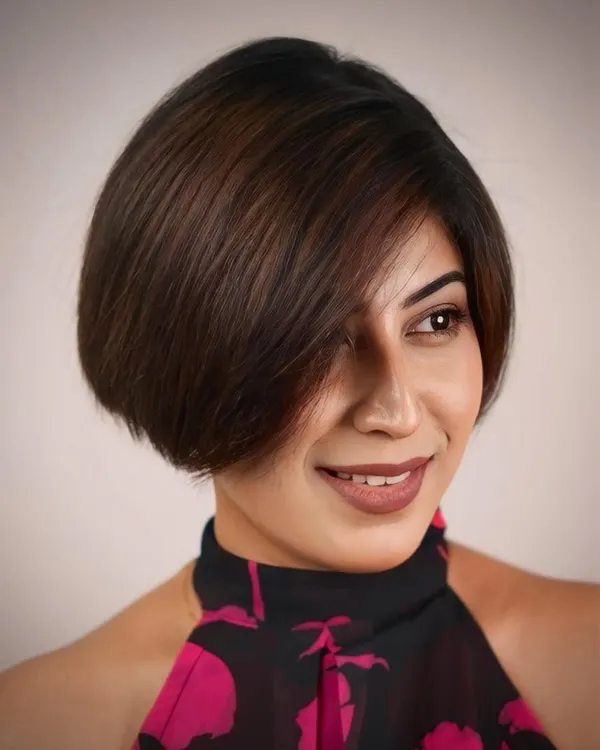 A chic and sophisticated bob haircut. The clean lines and subtle layering create a beautiful shape that is both modern and timeless.