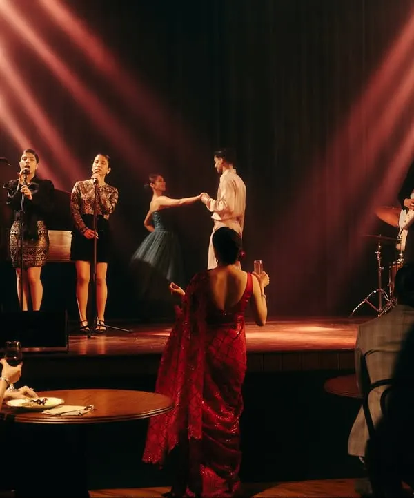 A wide shot from the Origin & Ode jazz bar campaign, establishing the entire scene. My role was to direct the creative vision, styling each character from the audience to the band to create a cohesive and believable world.