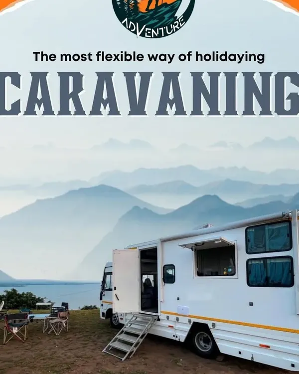 Our caravan parked by the water, with the side awning extended to create a perfect outdoor living space. This is your base for adventure, wherever you decide to stop.