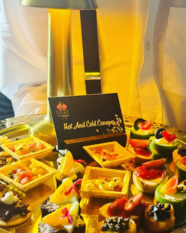 This tray of assorted hot and cold canapés shows the variety I can offer. Each bite is designed to be a burst of flavor, featuring different textures and ingredients to suit every palate.