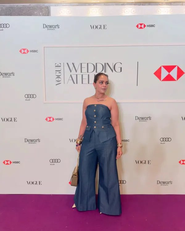 Attending the Vogue Wedding Atelier in a structured denim jumpsuit. This outfit is all about confidence, proving that the right fit and a powerful silhouette can make a statement at any high-profile fashion event.