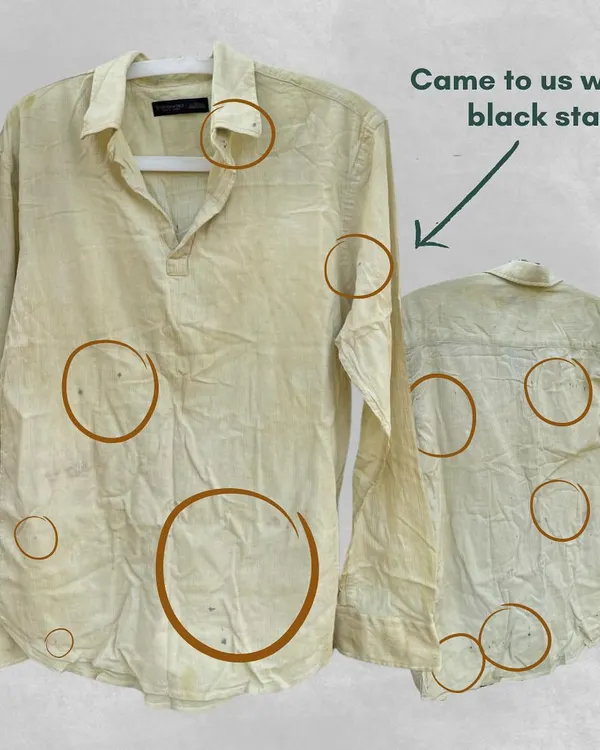 This shirt came to us with several black stains. Instead of discarding it, we saw an opportunity for transformation. This is the first step in our Resurrect service, where we assess a garment to plan its new design.