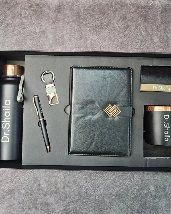 This sleek, personalized hamper was an absolute honor to create for the judges at a Vogue Fashion Institute event. The black and rose gold theme includes a custom-engraved bottle, pen, diary, and scented candle, all reflecting a sense of modern elegance.