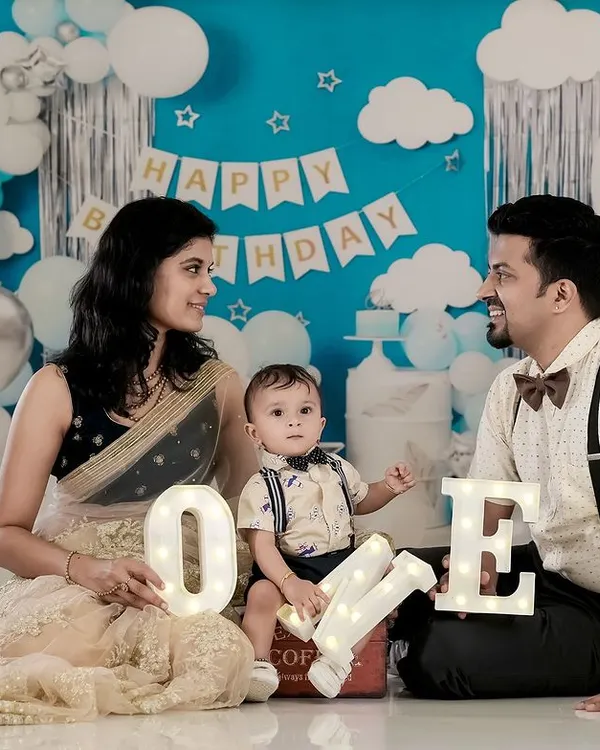 Happy First Birthday. We helped this family celebrate their son's big "ONE" with a custom birthday setup in our studio, complete with balloons and festive decorations for a memorable milestone photoshoot.