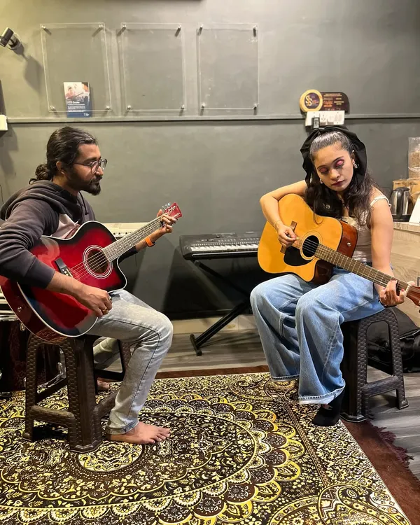 A typical one-on-one guitar lesson in our HSR Layout studio. Our instructor guides a student through chords and techniques, providing personalized feedback to help her improve quickly.
