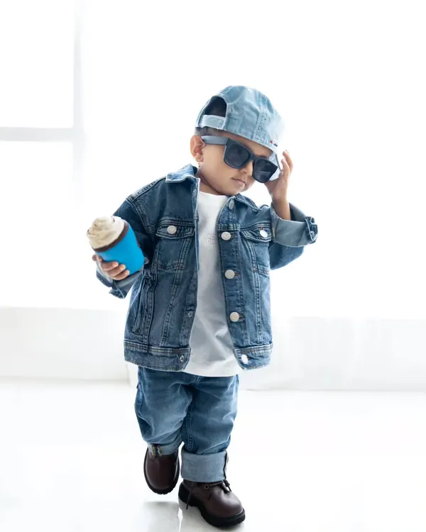 This little guy has so much swag! A cool toddler portrait with a full denim outfit, sunglasses, and a prop coffee cup.