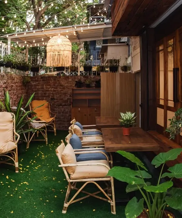 My outdoor seating area is a little oasis, filled with greenery and cozy corners. It's the perfect spot to unwind with a book and a cup of tea.
