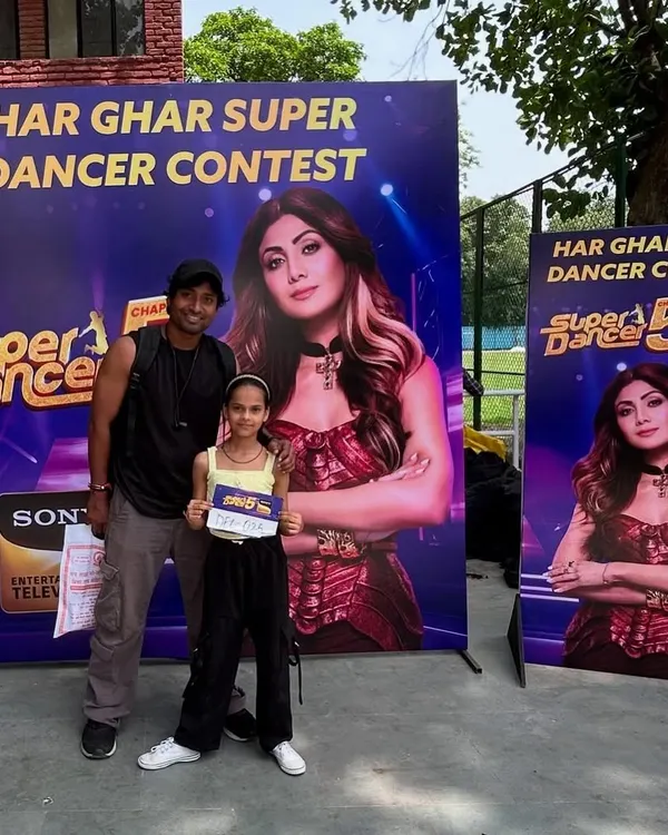 I believe in being there for my students every step of the way. Here I am with one of our dedicated dancers at the 'Super Dancer Chapter 5' television auditions, providing support right where it counts.