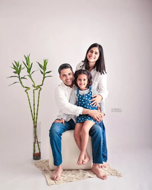 A classic and clean family portrait. We believe in timeless photos that capture the love and connection between parents and their child in a simple, beautiful way.