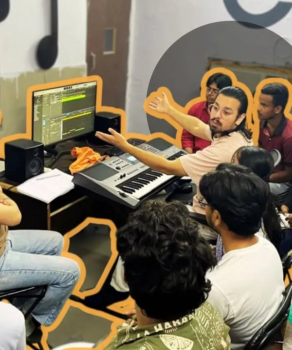 Our instructor breaks down a complex audio project for a group of engaged students. The curriculum is built around practical application, ensuring every student understands both the theory and the "haath ka kaam" of audio engineering.