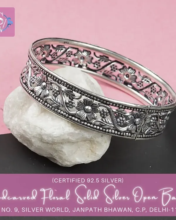 This bestselling hand-carved floral bangle is a masterpiece of craftsmanship. The intricate 'jaali' work and floral motifs make it a stunning piece of ethnic jewelry.