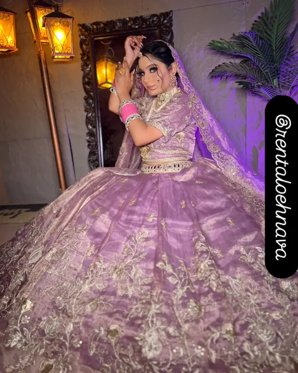 This grand lavender ball-gown lehenga is one of my most requested pieces. It has a massive flare with beautiful silver floral embroidery, perfect for creating a fairytale look for your engagement or pre-wedding shoot.