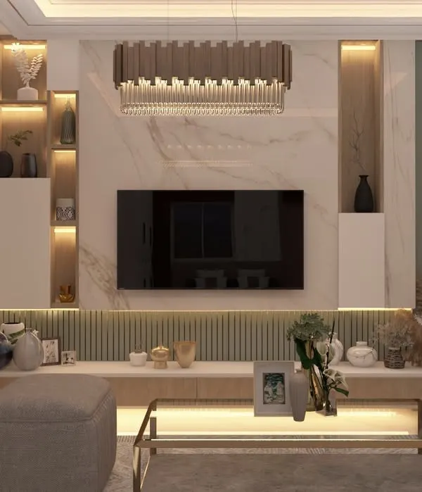 This living area exemplifies modern luxury with its integrated TV unit featuring a marble-finish accent wall and custom backlighting. The design balances sophisticated aesthetics with practical storage, creating a focal point that is both elegant and functional for a contemporary Bangalore home.