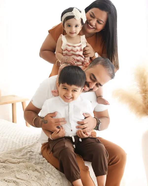 This is the heart of my work. Capturing the joyful, chaotic, and beautiful moments of a family simply being together. This playful pose in our boho-themed setup is a perfect example of the authentic memories we create.