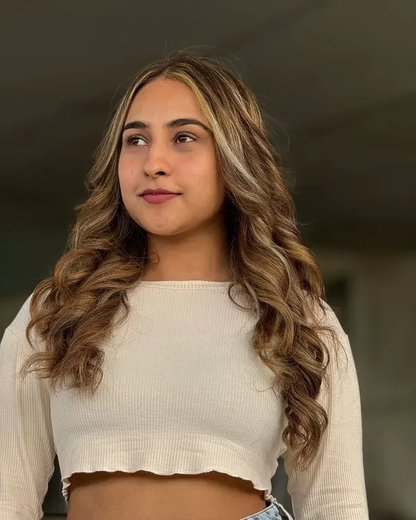 This is a beautiful hair makeover by one of my students. They created these soft, natural looking balayage highlights and styled the hair in flowing waves to perfectly frame the face.