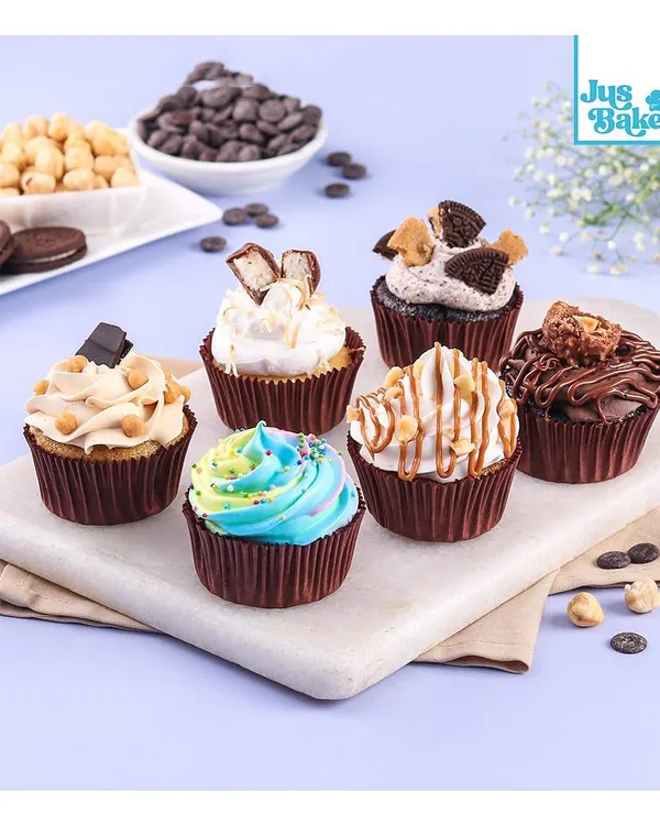 A delicious assortment of my cupcakes, ready for any occasion. There's something for everyone, from chocolate and caramel to a colourful rainbow swirl.