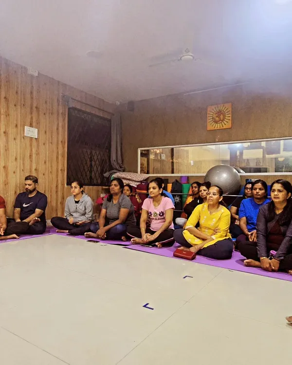 A moment of shared stillness during our Rathasaptami celebration. Our community gathers to honor the occasion with practice and reflection, embodying the principle of "Yoga for Self and Society."