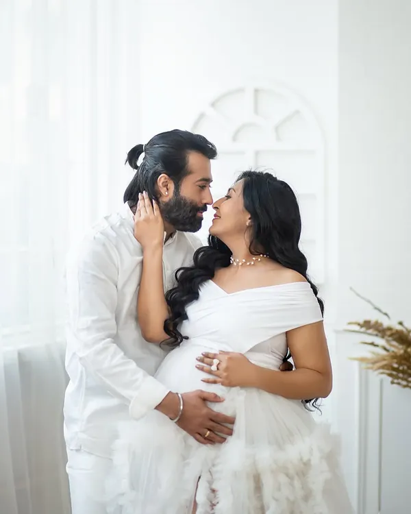 An intimate moment of connection, captured in the pure and simple setting of my all-white studio setup.