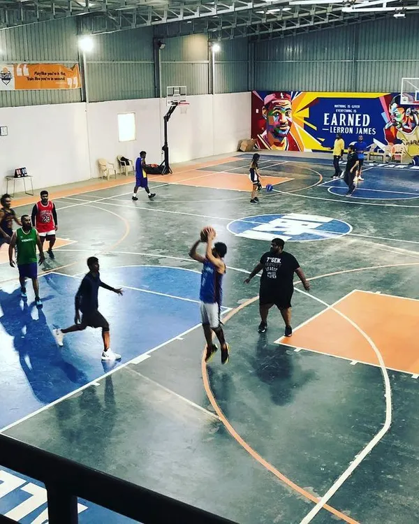 A great overhead view of a competitive game. Our court provides ample space for full-team basketball, perfect for booking with your friends or for team practice.