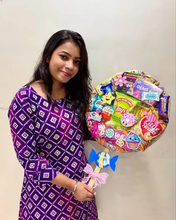Here I am with one of my handmade lollipop hampers, this one made for Rakhi. It's filled with all sorts of treats and can be customized for any occasion or budget.