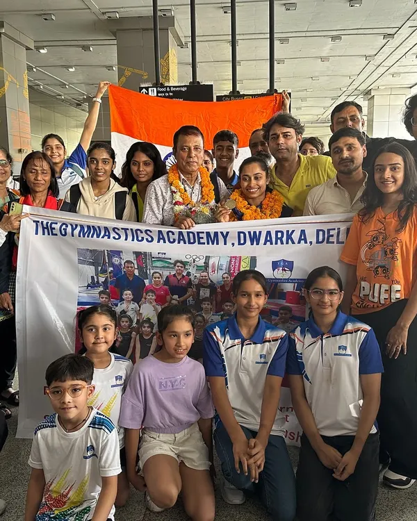 Our entire academy family gathers at the airport to welcome home Padma Shri Olympian Dipa Karmakar, holding our banner with pride.