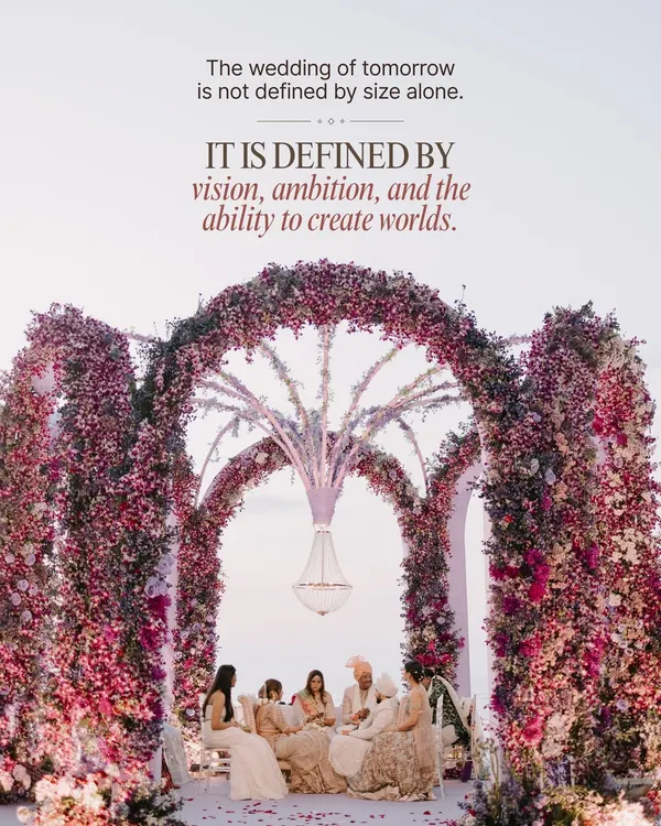 This is my philosophy. I don't plan events; I create worlds defined by vision and ambition. This beachside ceremony showcases a grand floral mandap with multiple arches, a hanging crystal chandelier, and an intimate family gathering, setting the stage for a wedding that is both monumental and deeply personal.