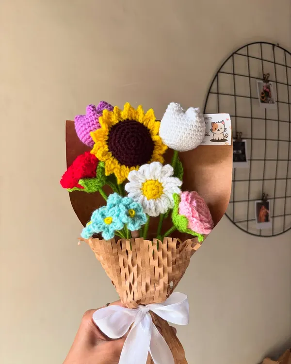 This vibrant mixed flower bouquet is a customer favorite. It features a sunflower, tulip, daisy, and rose, all handmade to last longer than any situationship.
