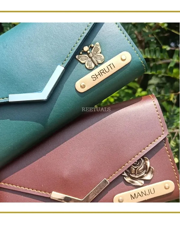 A personalized wallet is a classic gift that's always appreciated. I customized these elegant women's wallets with the names 'Shruti' and 'Manju' and added a unique charm for each, a butterfly and a rose, to match their personalities.