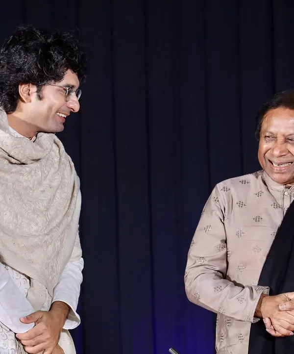 A candid moment of shared joy on stage with the legendary Ustad Shahid Parvez Khan Sahab during a concert in Surat. The unspoken communication between artists is the true magic of live accompaniment.