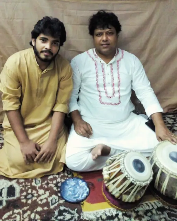 Another cherished photograph with my Guruji. The guru-shishya parampara, or the tradition of learning from a master, is the foundation of Indian classical music and my own journey.