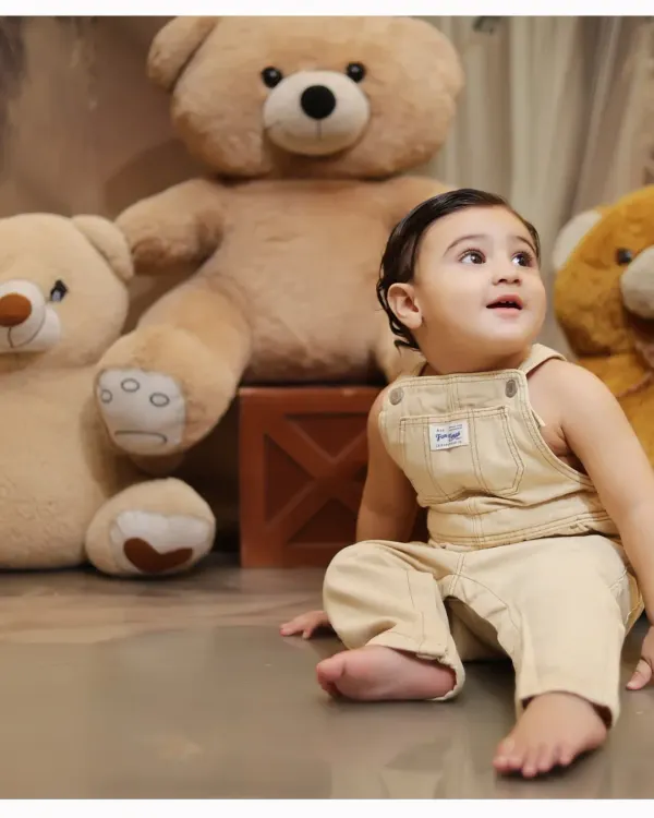 A candid, upward glance from a baby boy during our teddy bear themed shoot. We look for these spontaneous moments that reveal a child's curiosity.