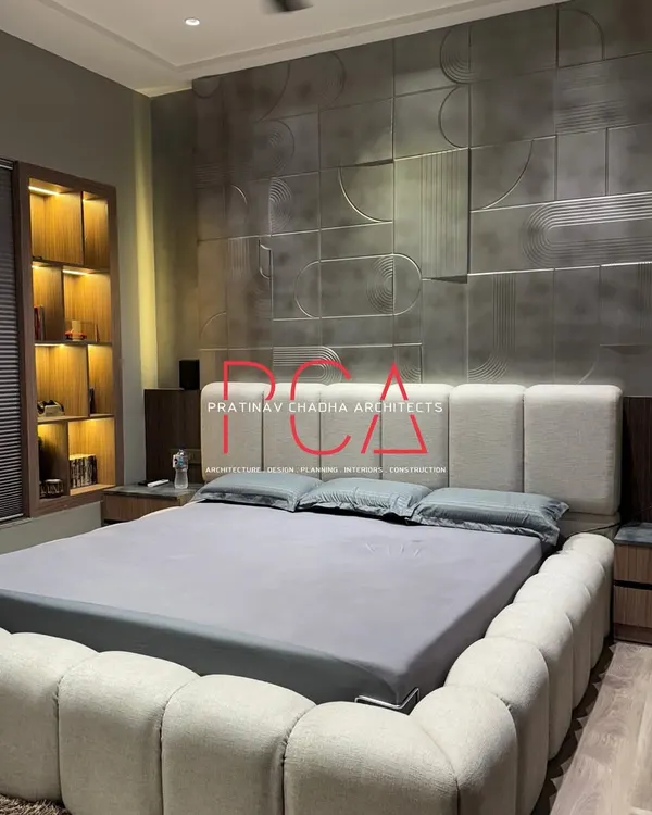 A full view of the son's room, highlighting the interplay between the antique silver-finished wall, the soft bouclé bed, and the warm wood flooring. The design balances bold textures with a calm, neutral color palette for a sophisticated yet comfortable atmosphere.