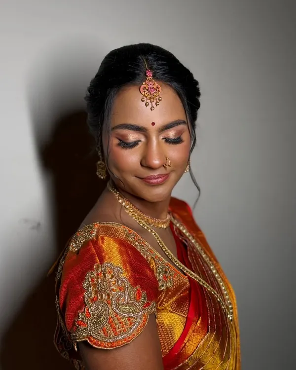 A moment of quiet grace. I used warm, diffused eyeshadows and a soft highlighter to create a gentle, moonlit glow that enhances her features without feeling heavy.