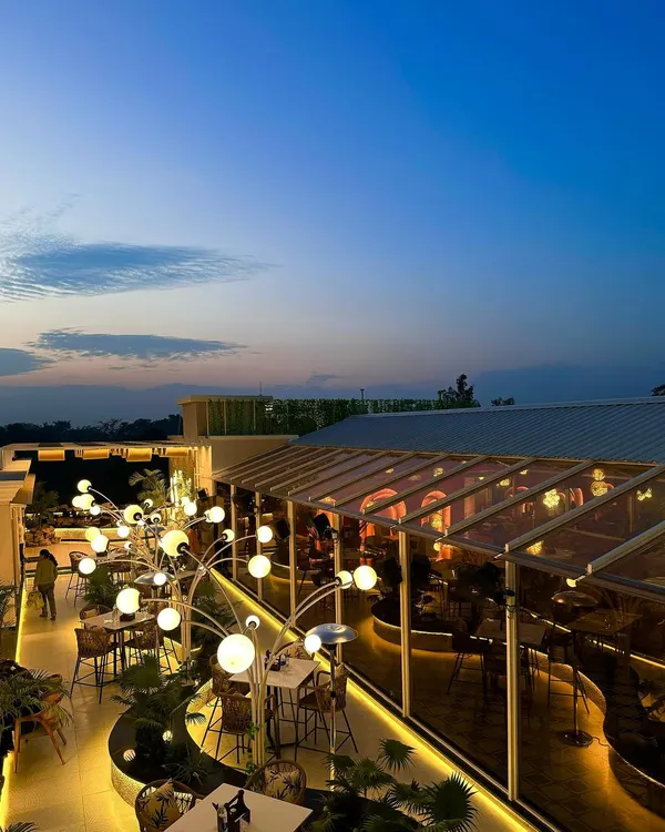 The Tipsy Town rooftop at dusk, a moment when the architectural lighting begins to take over. The design aims to create a future forward space that still feels deeply connected to nature.