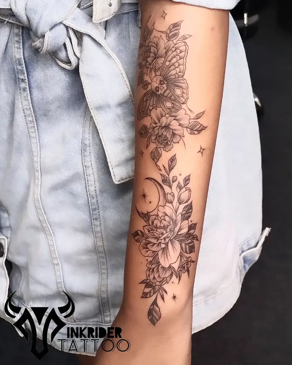 A beautiful and intricate floral sleeve featuring peonies, a crescent moon, and a deaths-head hawkmoth. This design combines elements of nature with celestial and gothic themes.