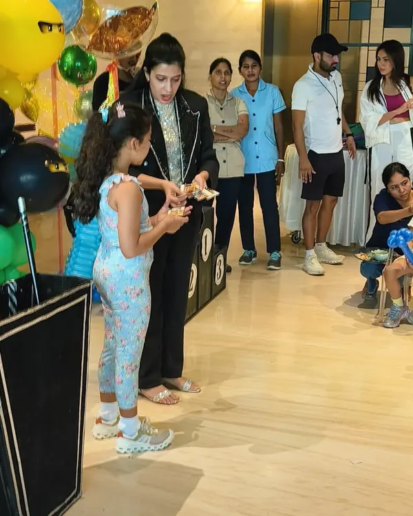 Here I am with a young assistant during a trick at Shahid Kapoor's son Zain's birthday party. I always make sure the birthday child and their friends feel like they are part of the magic.