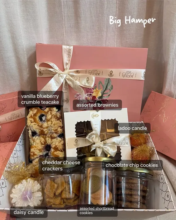 This is my Big Hamper for Diwali, and I get so excited putting it together. It’s filled with a vanilla blueberry crumble teacake, assorted brownies, jars of cookies and cheddar cheese crackers, and even a couple of festive candles. It's the perfect gift when you want to be a little extra.