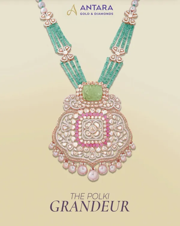 The Polki Grandeur, crafted for moments you’ll cherish. This magnificent pendant necklace combines a large polki centerpiece with emerald beads and delicate pearl drops.