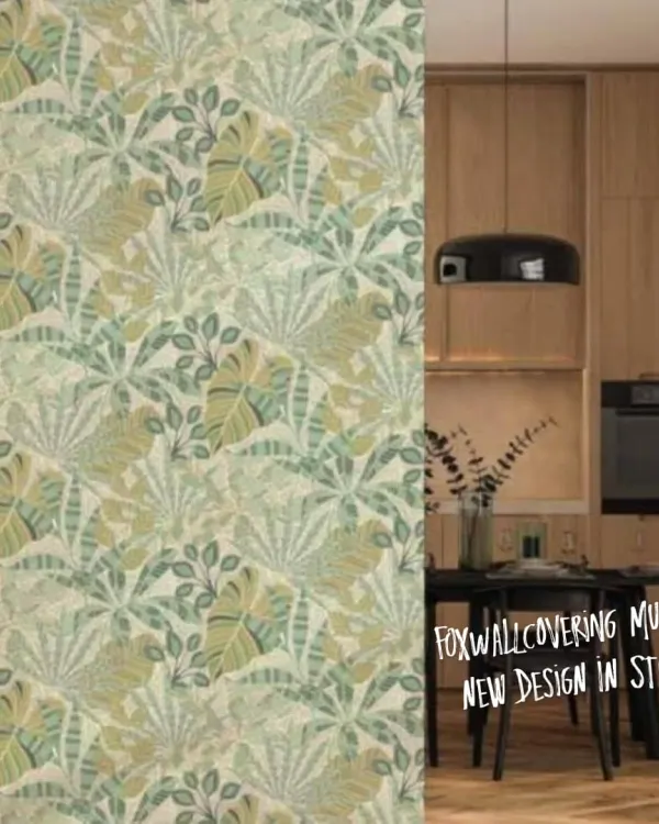 A light and airy tropical leaf pattern wallpaper shown in a kitchen and dining area. This repeating design brings a fresh, botanical feel to the space.