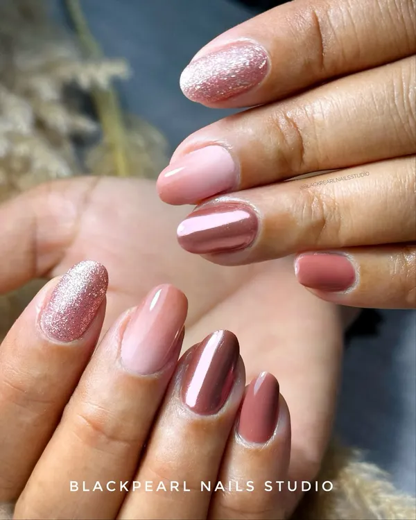 This has become a classic favorite at the studio, recreated over 50 times. It combines ombré, chrome, and glitter for a look that's perfect for any occasion, from casual to bridal.