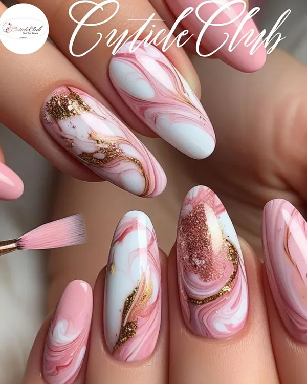 This is the kind of art I love to create. This look features almond-shaped gel extensions with a beautiful pink and white marble effect, highlighted with delicate gold foil. It's a perfect example of sophisticated, hand-painted nail art that’s sure to get you compliments.