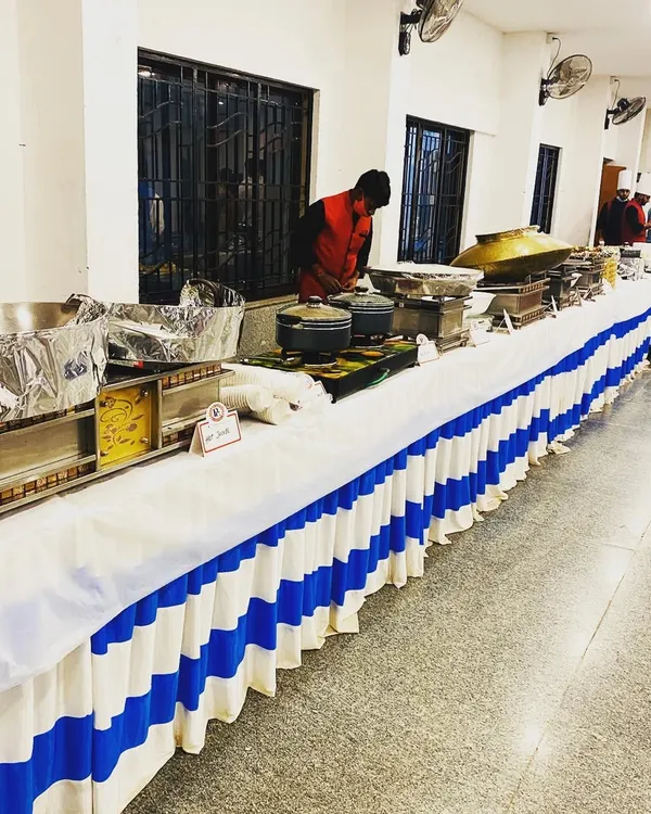 A clean and simple buffet setup for an indoor event. Even for more modest arrangements, I ensure the food is delicious and the service is professional.