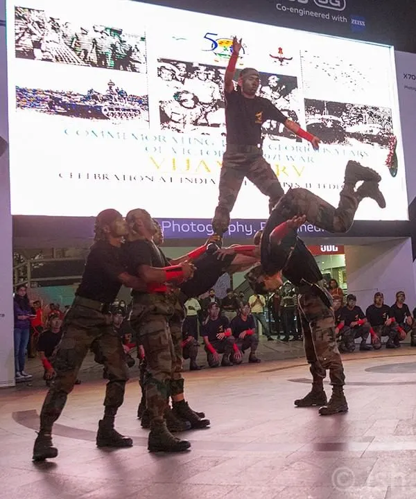 An action shot of the Indian Army's acrobatic team performing at the 'Vijay Parv' celebration in Cyberhub, Gurugram. My event photography aims to capture the most dynamic and visually compelling moments.