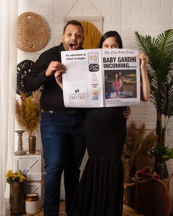 We love capturing pure excitement, and this custom newspaper announcement is a perfect way to do it. The couple's joyful expressions say it all: "Baby Gandhi Incoming!"