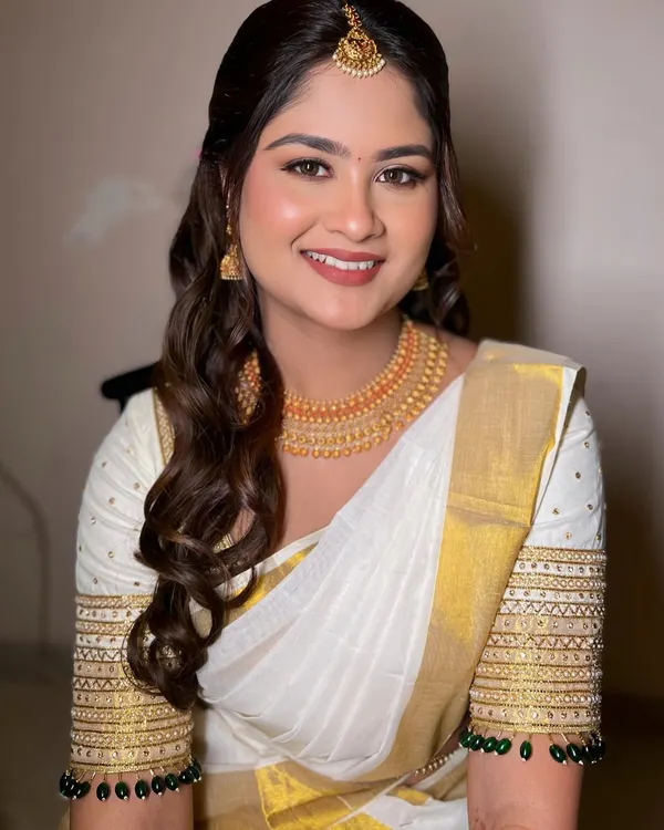 This is my signature 'minimal magic' style. For my beautiful South Indian bride Kirthana, we created a soft, glowing look that felt fresh, timeless, and completely her.