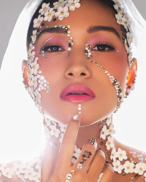 This is what it means to think outside the box. We teach you how to use unconventional materials like these flowers and crystals to create true makeup art.