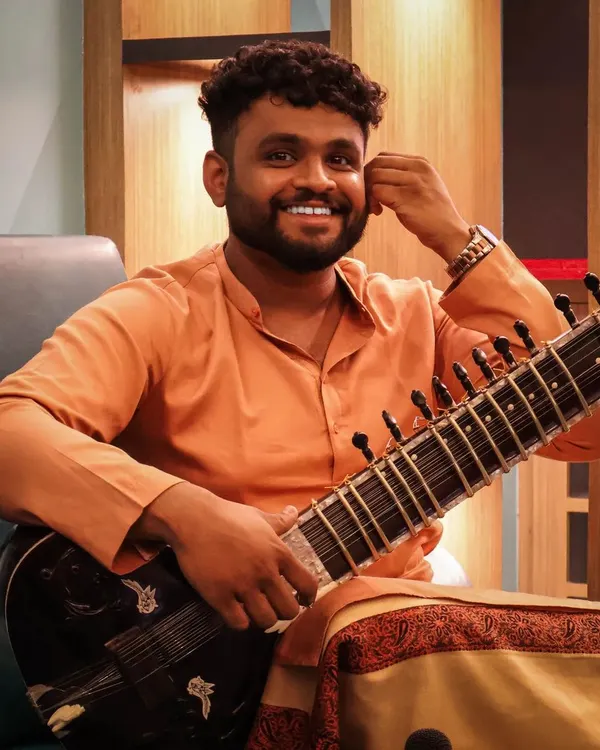 Just me, my sitar, and a smile. I believe in bringing a positive and collaborative attitude to every project I am a part of.