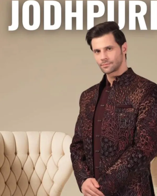 Our Jodhpuri suits are a perfect blend of tradition and modern style. This piece features a unique printed fabric with a rich texture, tailored for a sharp, regal silhouette. It's an ideal choice for sangeet, engagements, or any festive occasion.